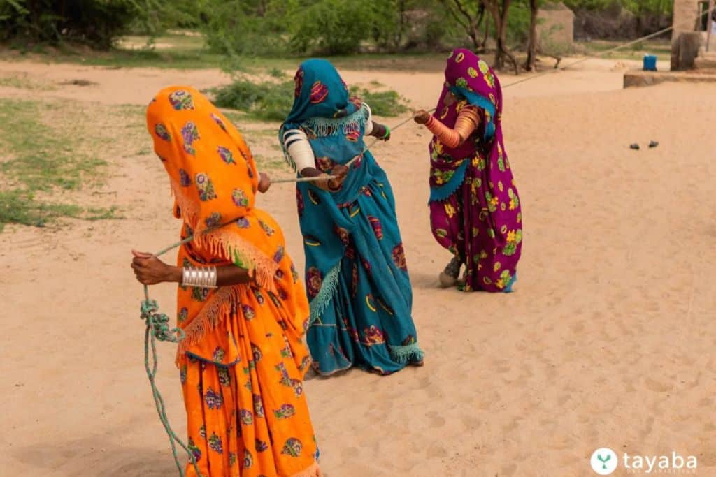 Women pull water from a 350 ft. deep well in Umerkot, a strenuous task they must undertake after walking up to 4 hours to reach the well.